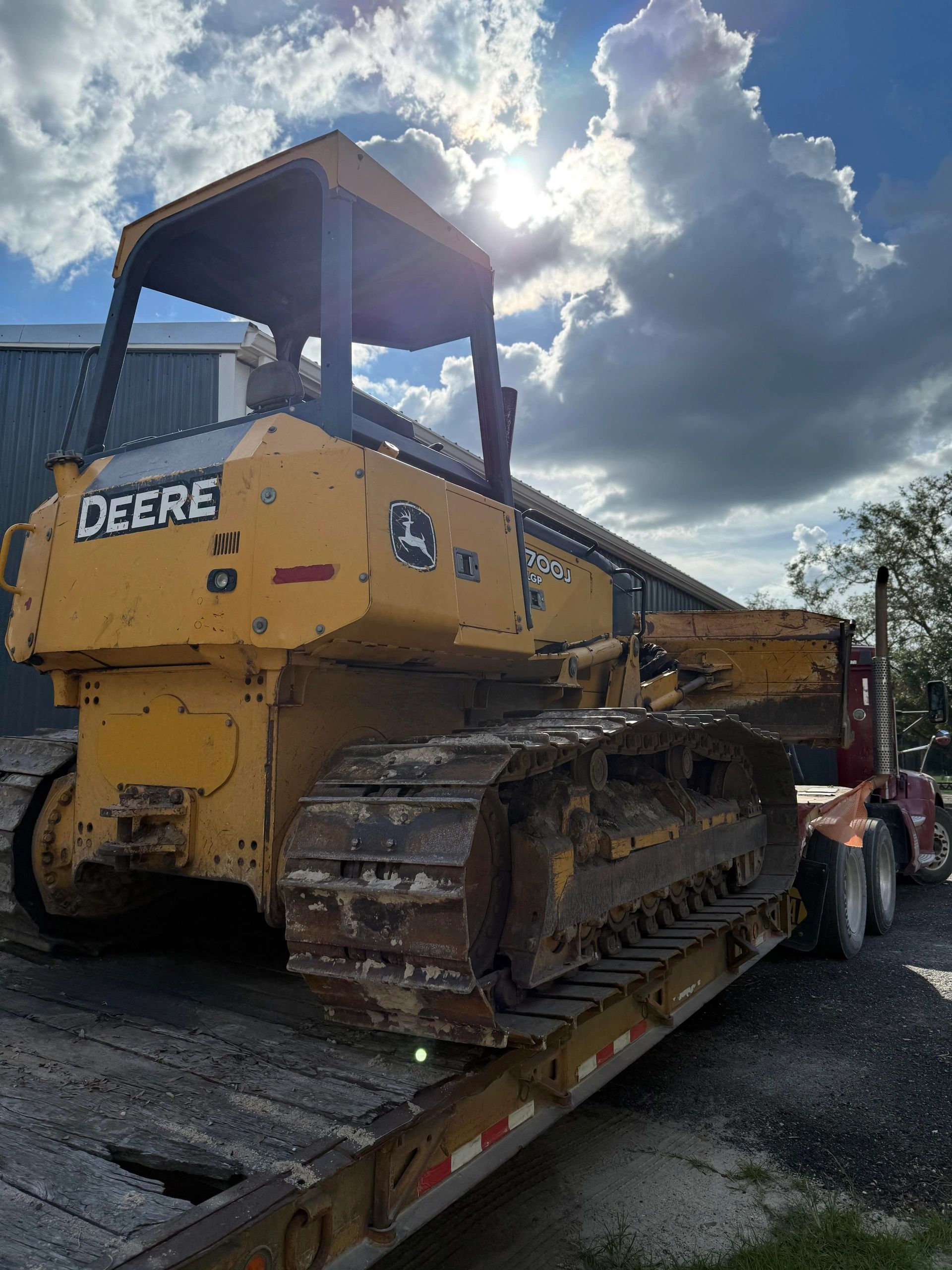 John Deere 700J dozer loaded on the Royster Construction trailer