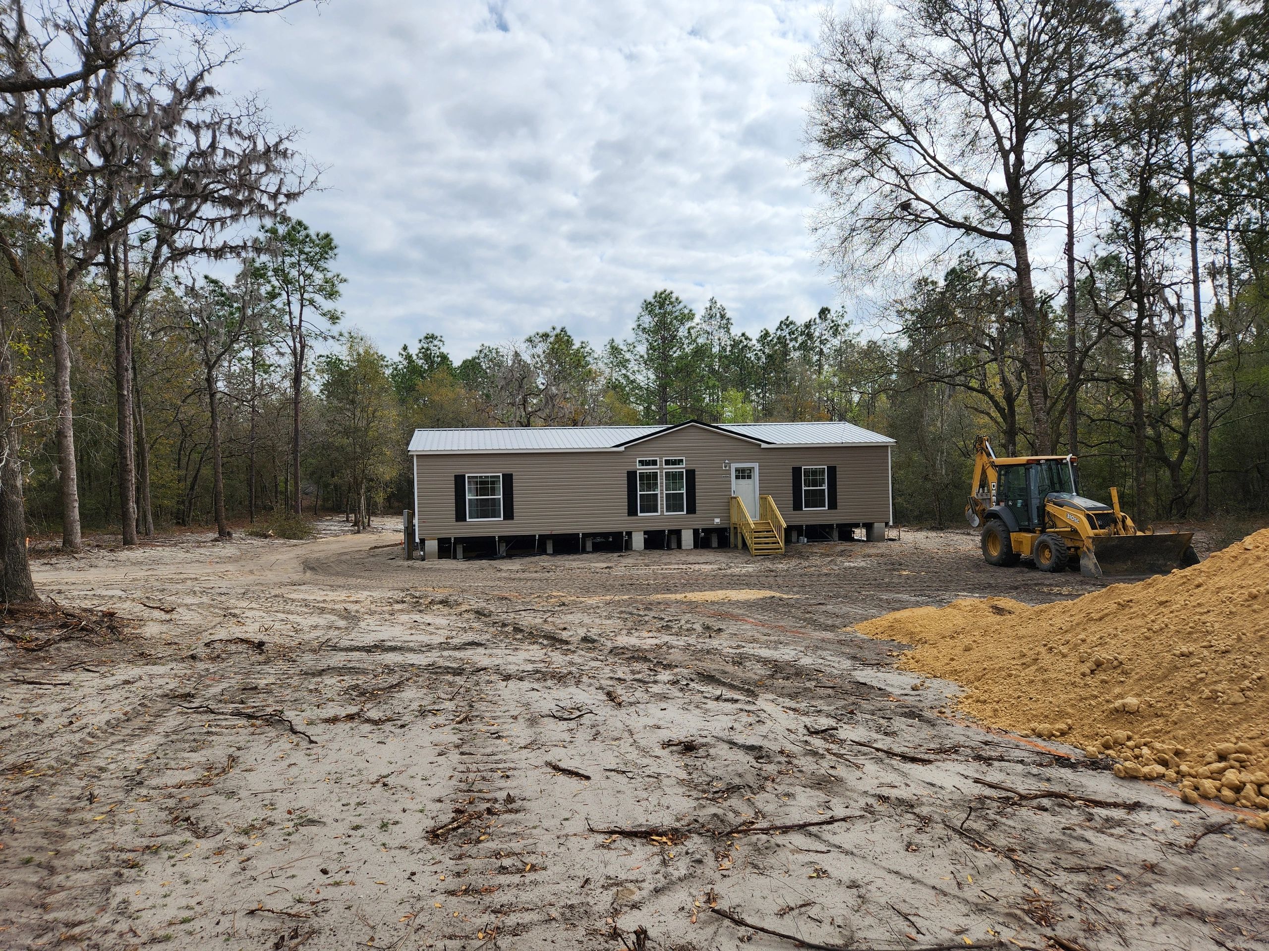 Cleared lot and pad set for a manufactured home