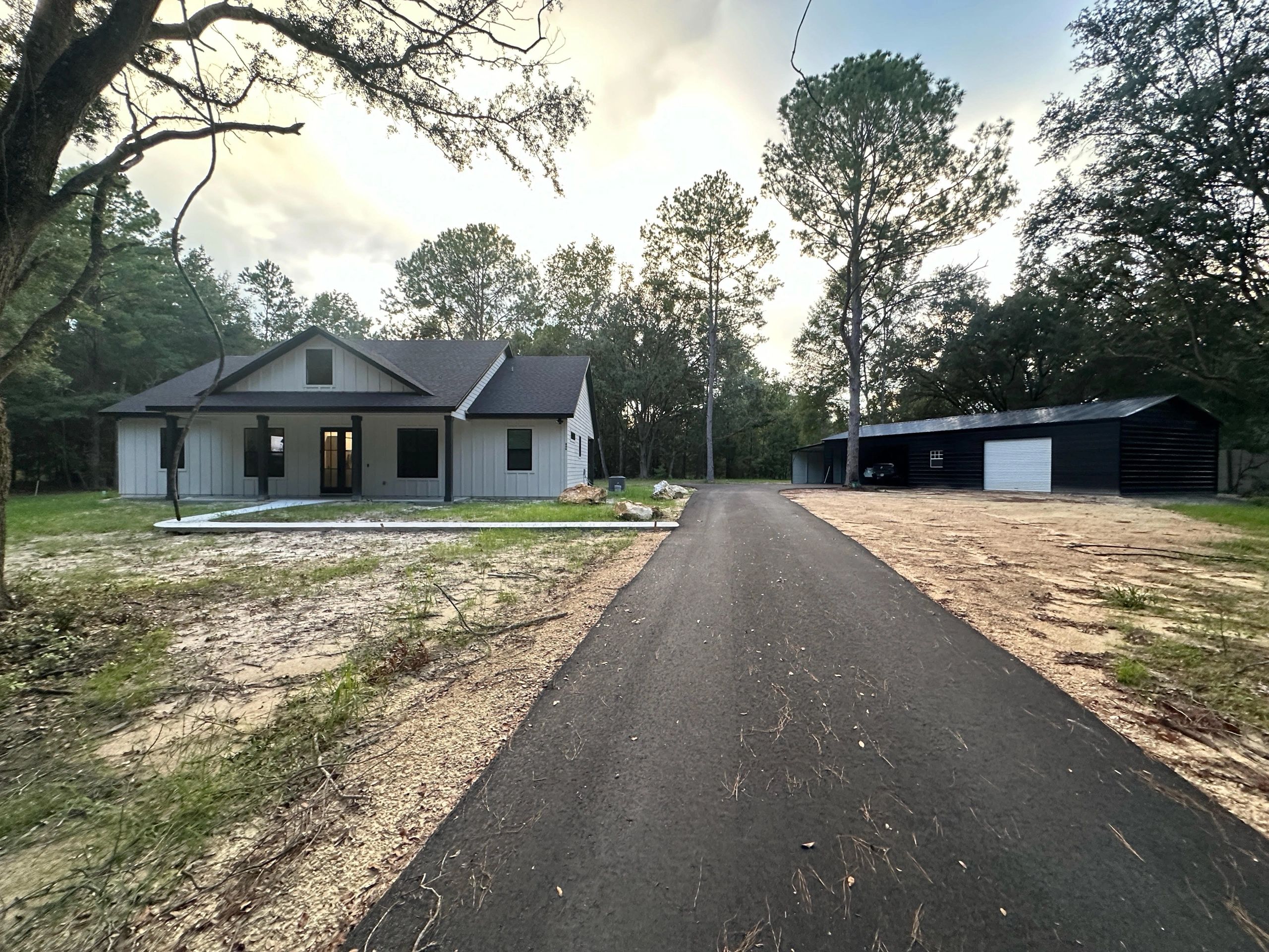 Finished asphalt driveway installed by Royster Construction in North Florida