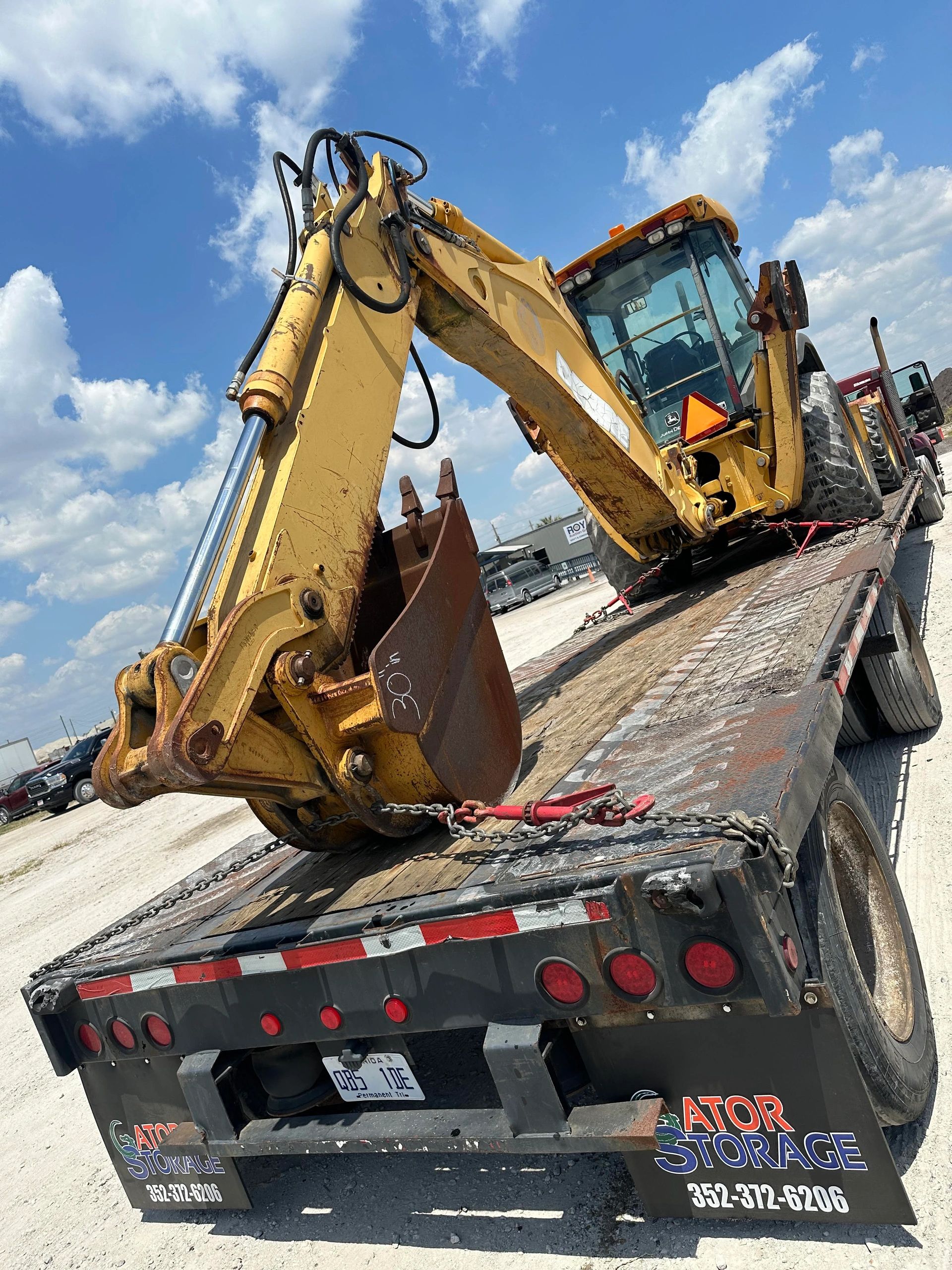 Backhoe chained down and ready to haul