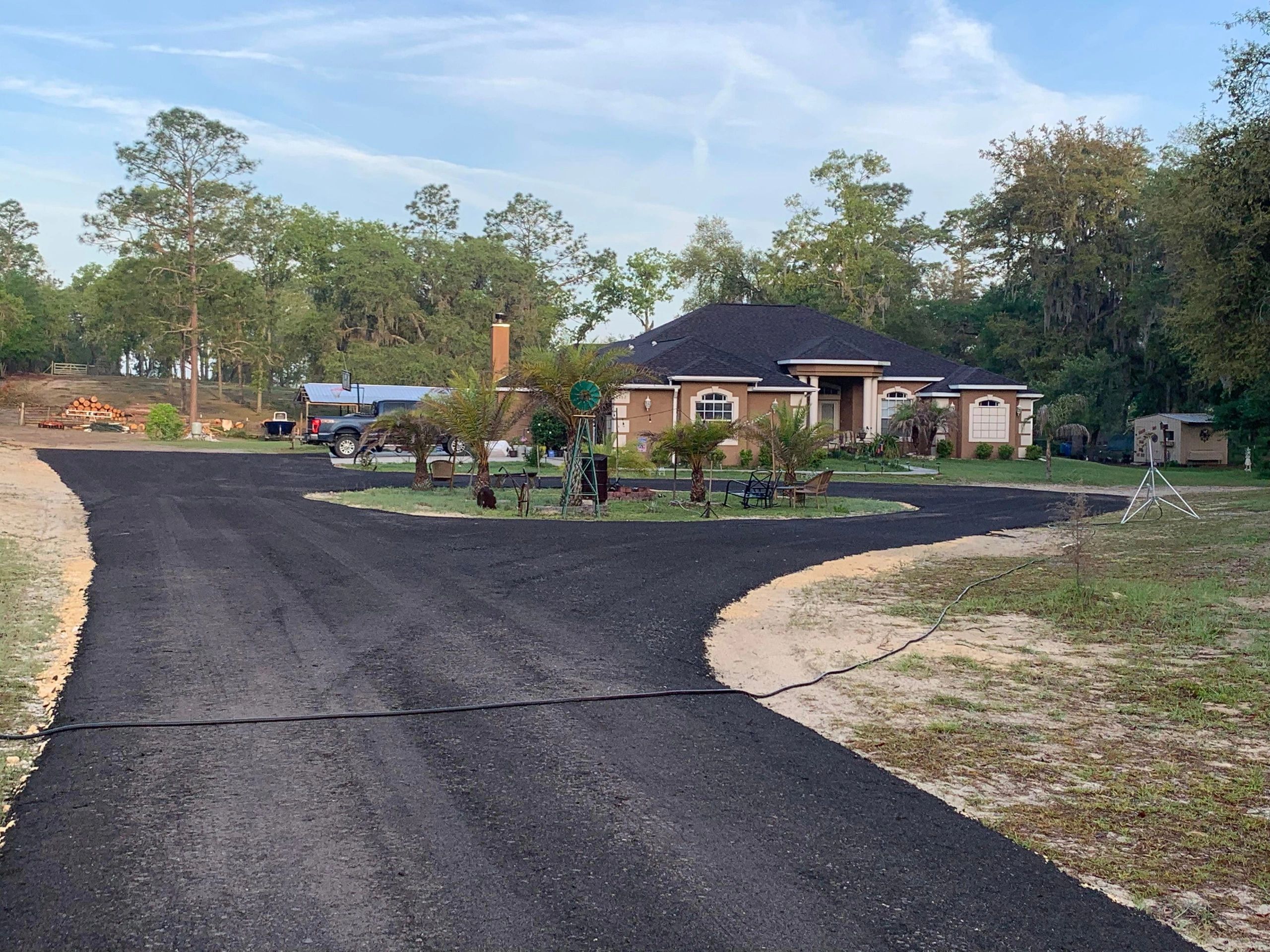 Finished circular asphalt driveway, Gilchrist County